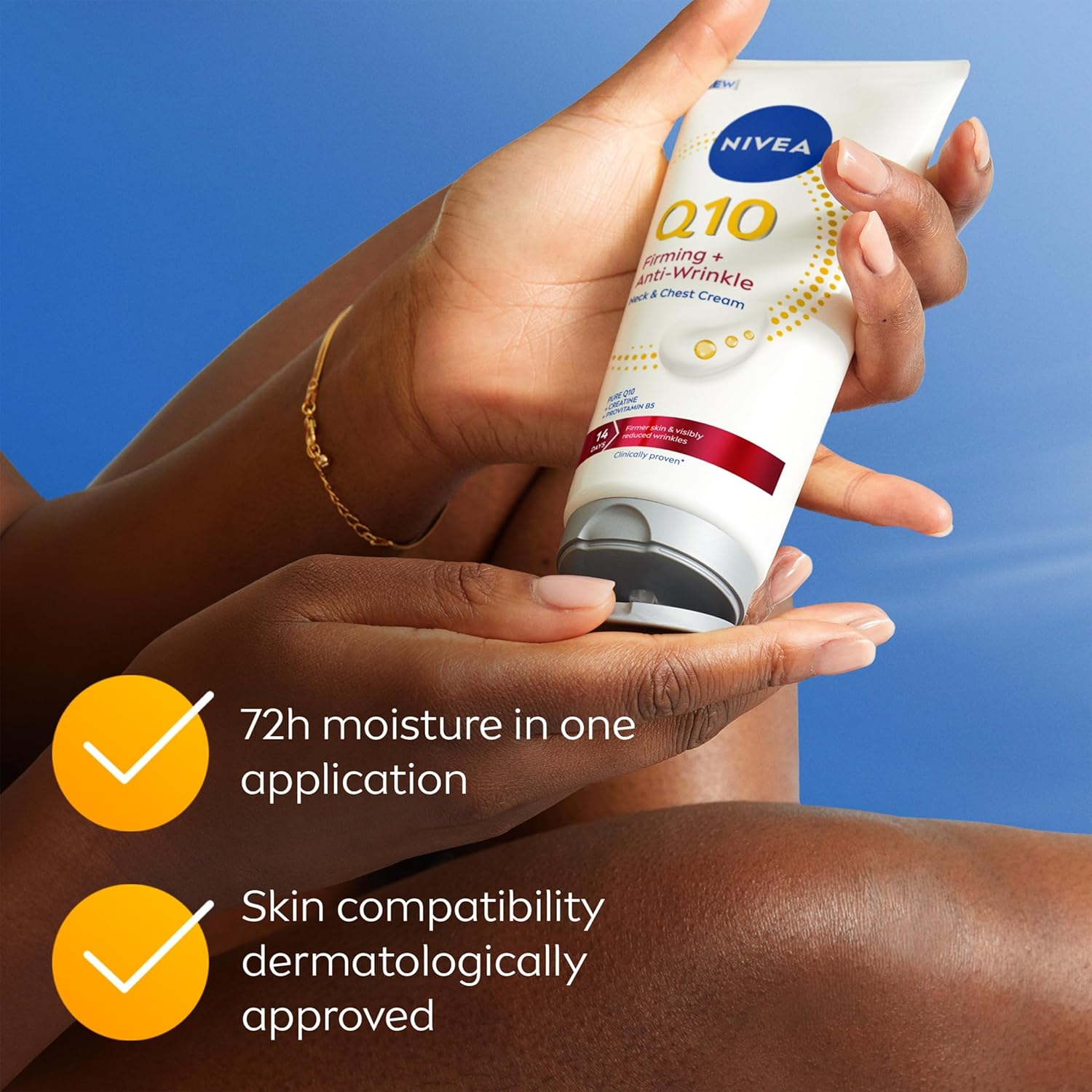 Nivea Q10 cream tube held by a person against a blue background