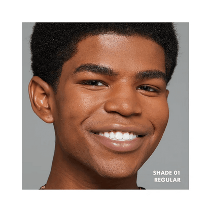 Close-up of a smiling person showcasing NYX Professional Makeup Foundation in Shade 01 Regular.