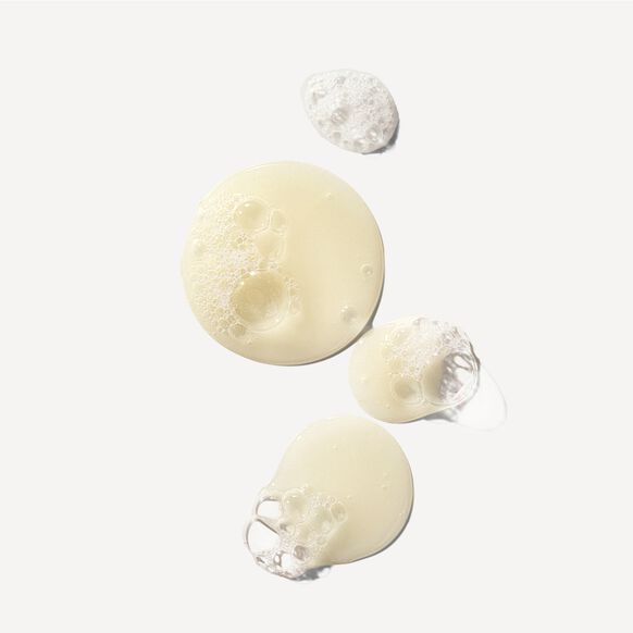 Olaplex cosmetic sponges with textured surfaces on a light gray background