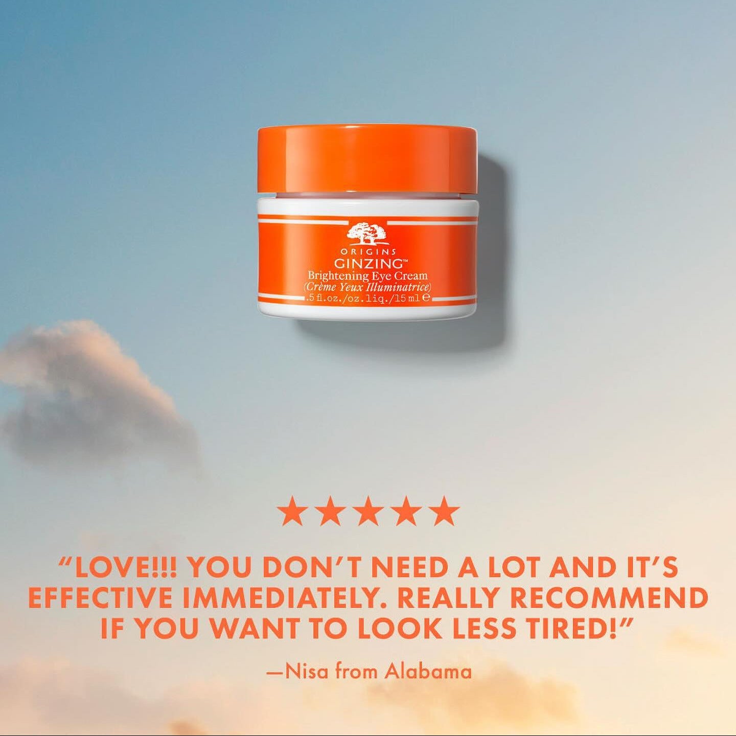 Origins Ginzing product jar with a blue gradient background and customer review text.