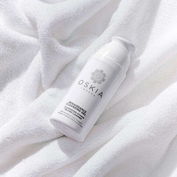Oskia skincare product on a white towel