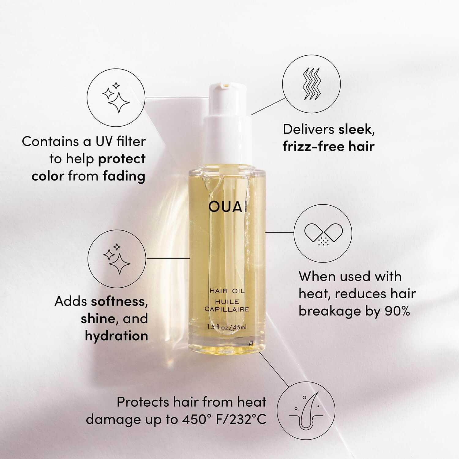 OUAI hair oil bottle with features listed on a light gray background