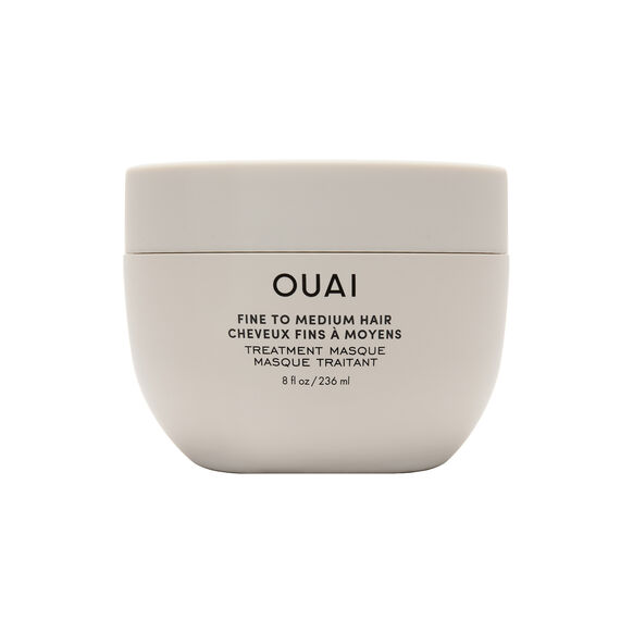 OUAI Beige hair mask container with 'OUAI' branding on a white background