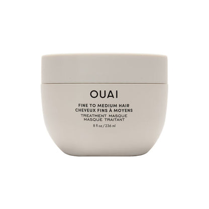 OUAI Beige hair mask container with 'OUAI' branding on a white background