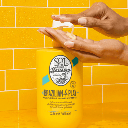 Sol de Janeiro Brazilian 4 Play Moisturizing Shower Cream-Gel being dispensed from a yellow bottle.