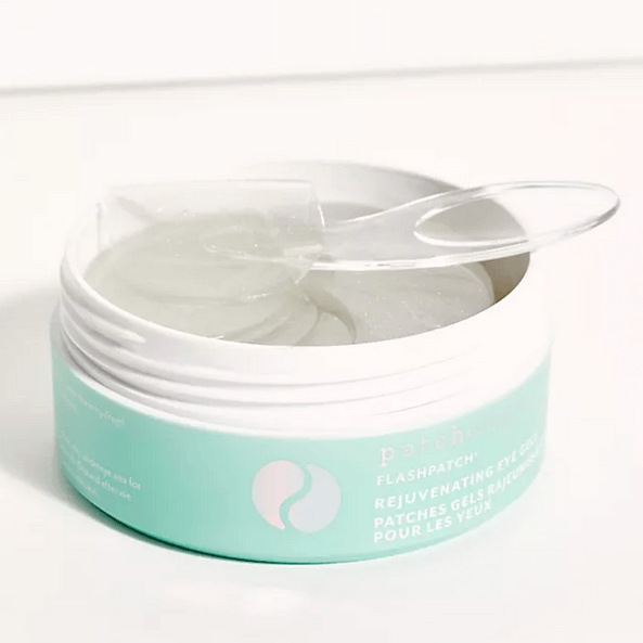 Jar of Patchology eye patches with a white lid on a white background