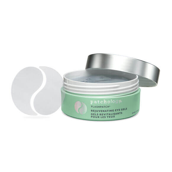 Green jar of Patchology eye gels with a silver lid on a white background