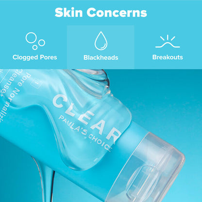 Bottle of Paula's Choice Clear skin care product with icons for clogged pores, blackheads, and breakouts on a blue background.