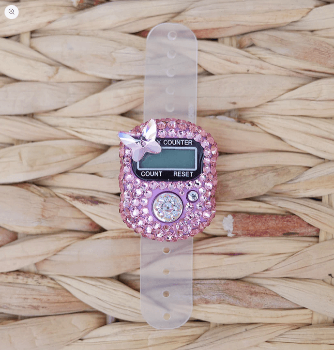 Pink Butterfly Tasbih/Tally Counter with Light Rose crystals and butterfly motif on a woven background