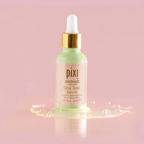  PIXI Glow Tonic Serum bottle on a pink background