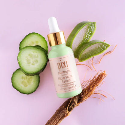  PIXI skincare serum bottle with cucumber slices and aloe vera leaves on a pink background
