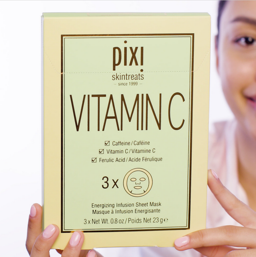  PIXI Vitamin C skincare product packaging held by a person