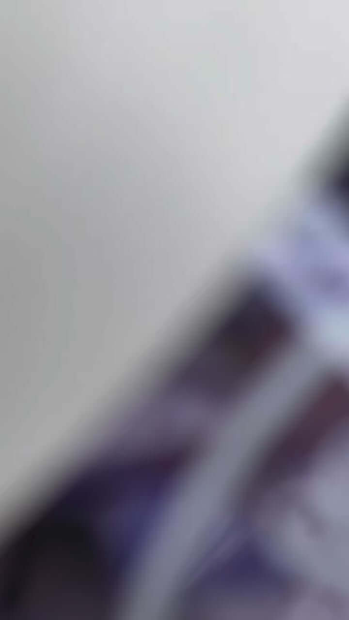 Blurry image of Sol de Janeiro Delicia Drench Shower Oil packaging emphasizing luxury and hydration.