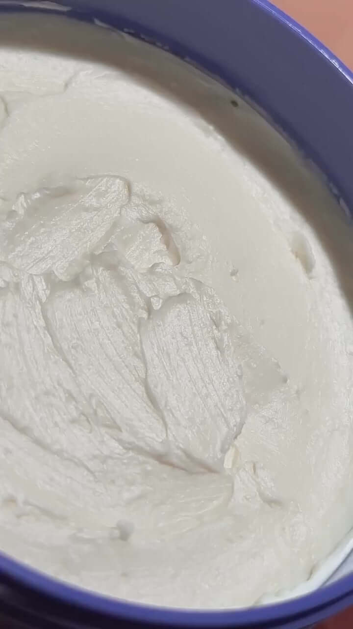 Close-up of Sol de Janeiro Delicia Drench Body Butter, creamy texture for soft, hydrated skin.