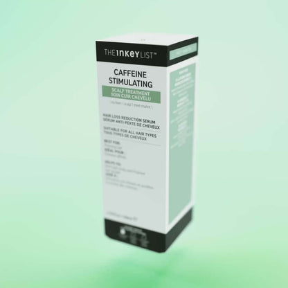 The INKEY List Caffeine Stimulating Scalp Treatment packaging on a green background, promoting hair health.