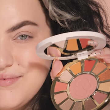 TARTE Rainforest Temptations eye & cheek palette showcasing 12 warm shades and rosy pink blush in a stylish compact.