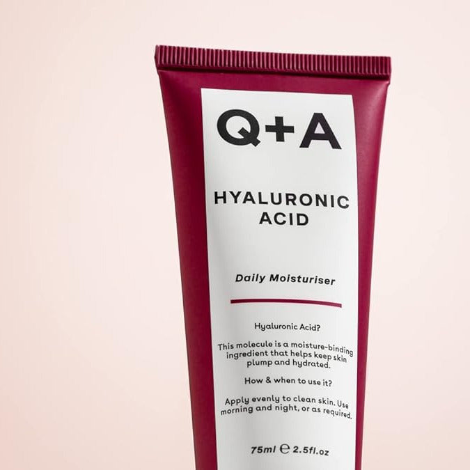 Q+A Hyaluronic Acid Daily Moisturizer tube on a light pink background