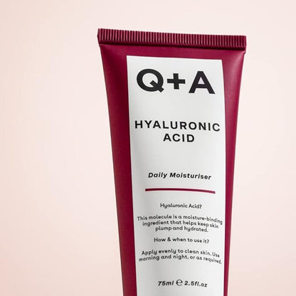 Q+A Hyaluronic Acid Daily Moisturizer tube on a light pink background