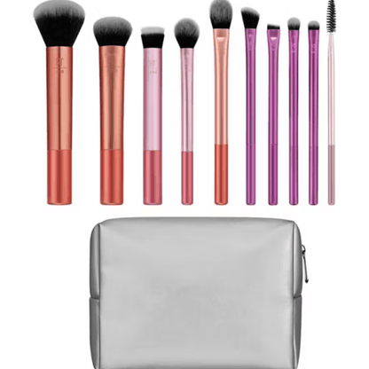 Set of Real Techniques makeup brushes with gradient handles and a gray case on a white background