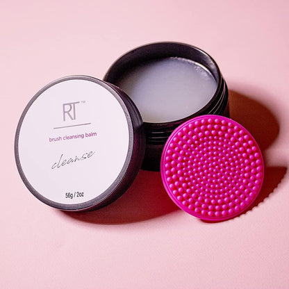Real Techniques brush cleansing balm with pink brush on a pink background