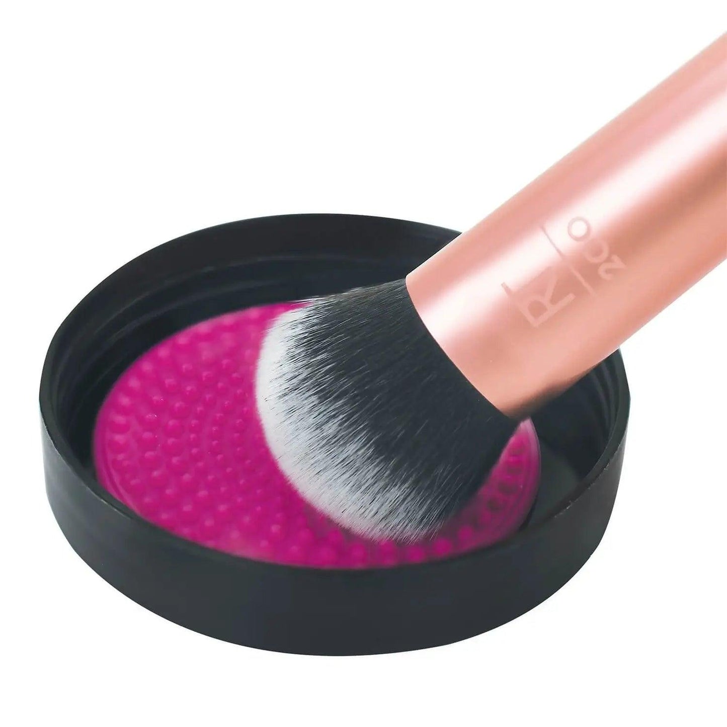 Real Techniques Brush Cleansing Balm with brush on cleansing pad for effective makeup brush cleaning.