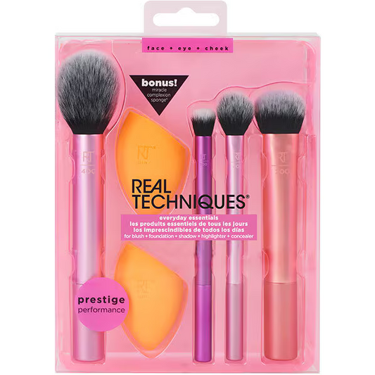 Real Techniques makeup brush set with packaging on a white background