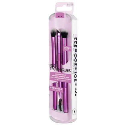 Set of makeup brushes in a pink packaging with Real Techniques branding on a white background.