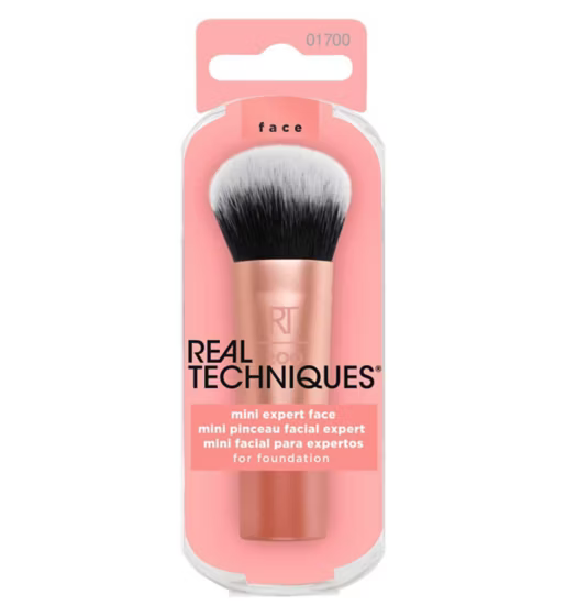 Real Techniques makeup brush in packaging on a white background