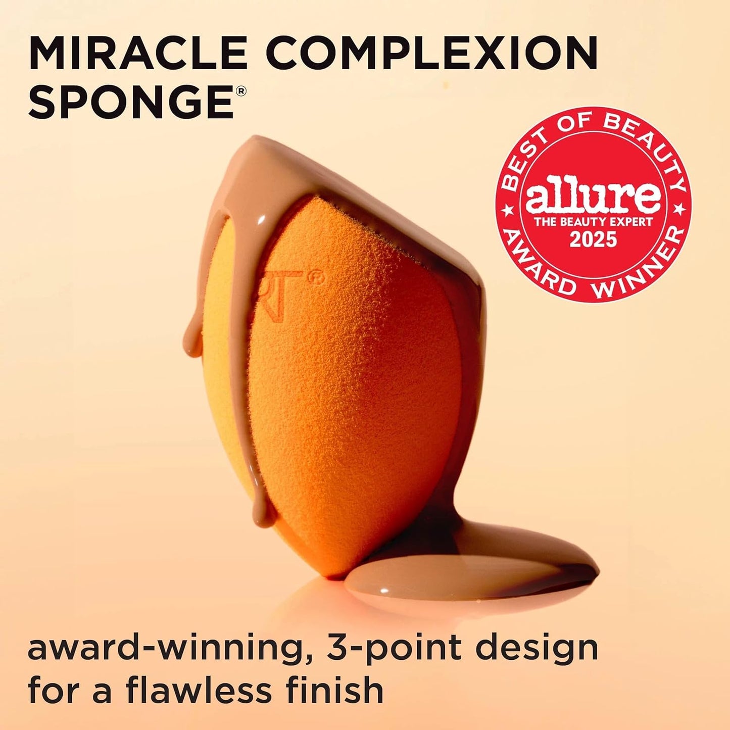 Orange makeup sponge with beige liquid on a beige background, featuring the Allure Best of Beauty 2025 award.