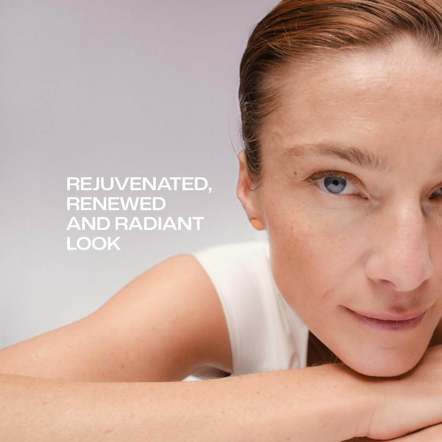 Woman with a rejuvenated, renewed, and radiant look Lumene on a gray background