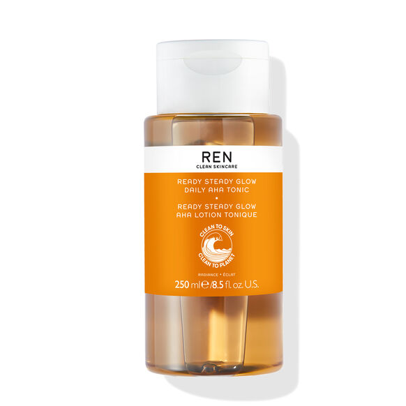 Ren skincare bottle with orange label on a white background