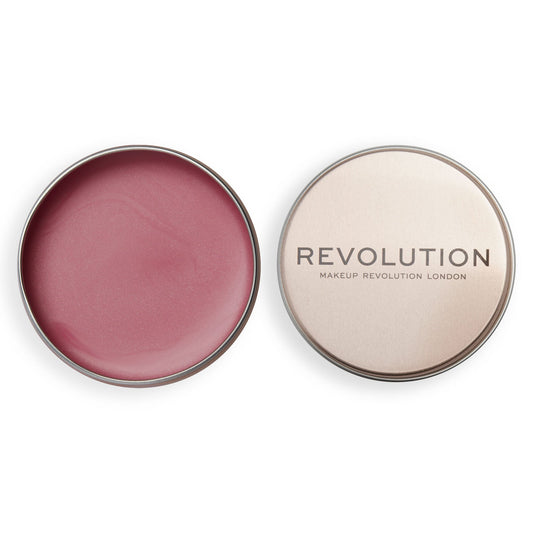 Revolution Lip & Cheek Balm Glow in a metal tin, showcasing a creamy blush for a dewy finish.