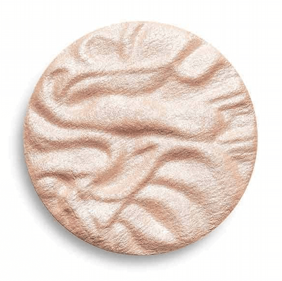Revolution Pale-gold powder highlighter in a round pan, showcasing a silky texture and shimmering finish for radiant skin.