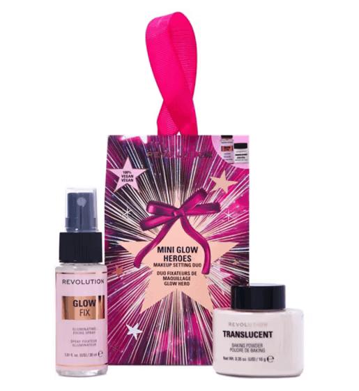 Revolution Mini Glow Heroes Makeup Setting Duo with Glow Fix spray and Translucent powder in festive packaging.