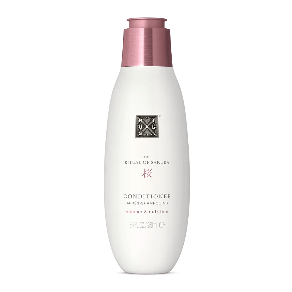RITUALS The Ritual of Sakura Conditioner bottle for smooth, voluminous hair, infused with rice extract and macadamia oil.