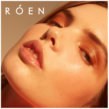Close-up of a person's face with 'RÓEN ' branding.