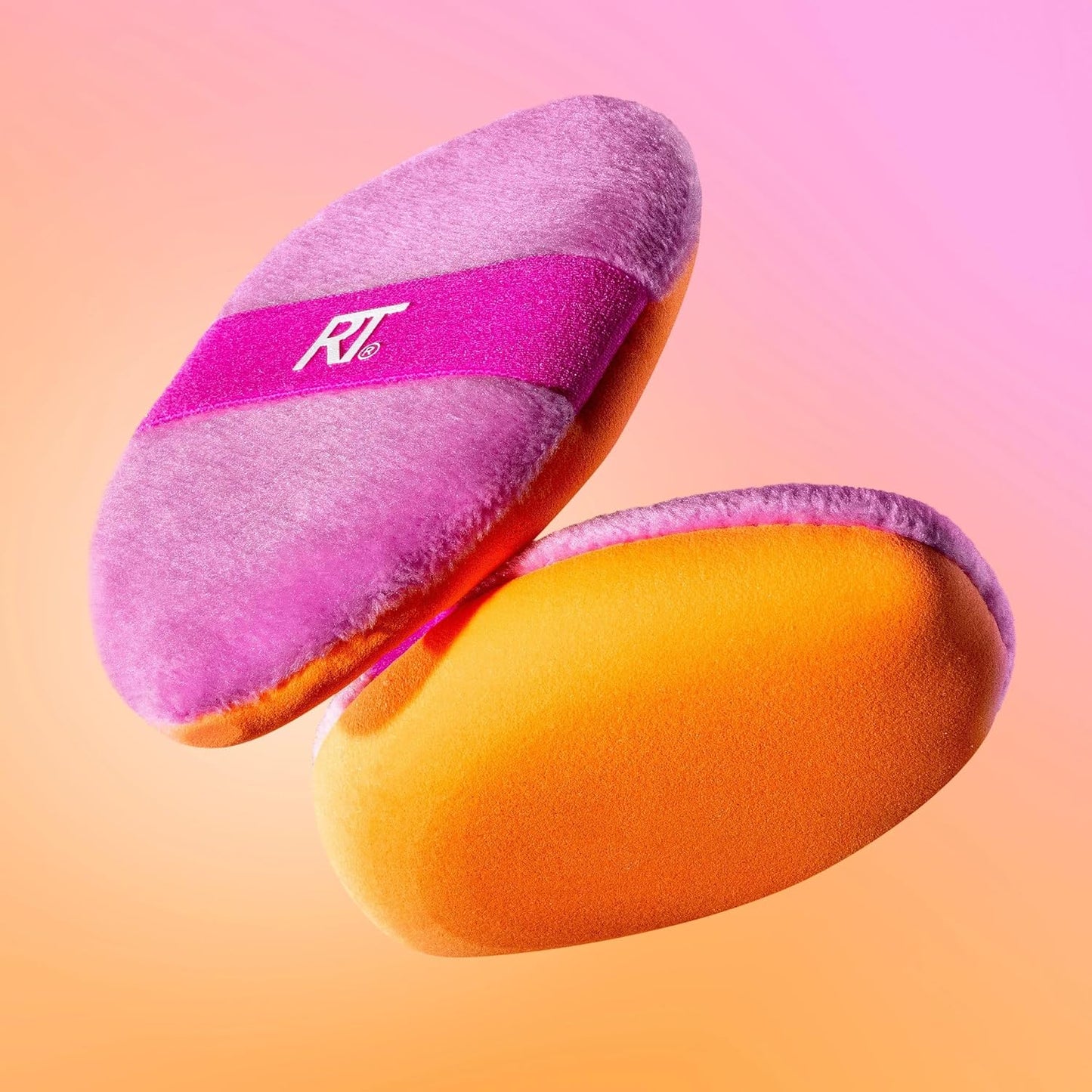 Pink and orange makeup sponges with 'RT' logo on a gradient background