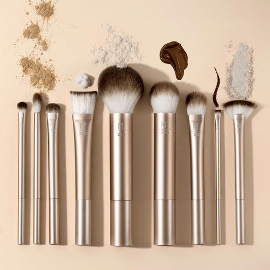 Set of makeup brushes with decorative elements on a beige background