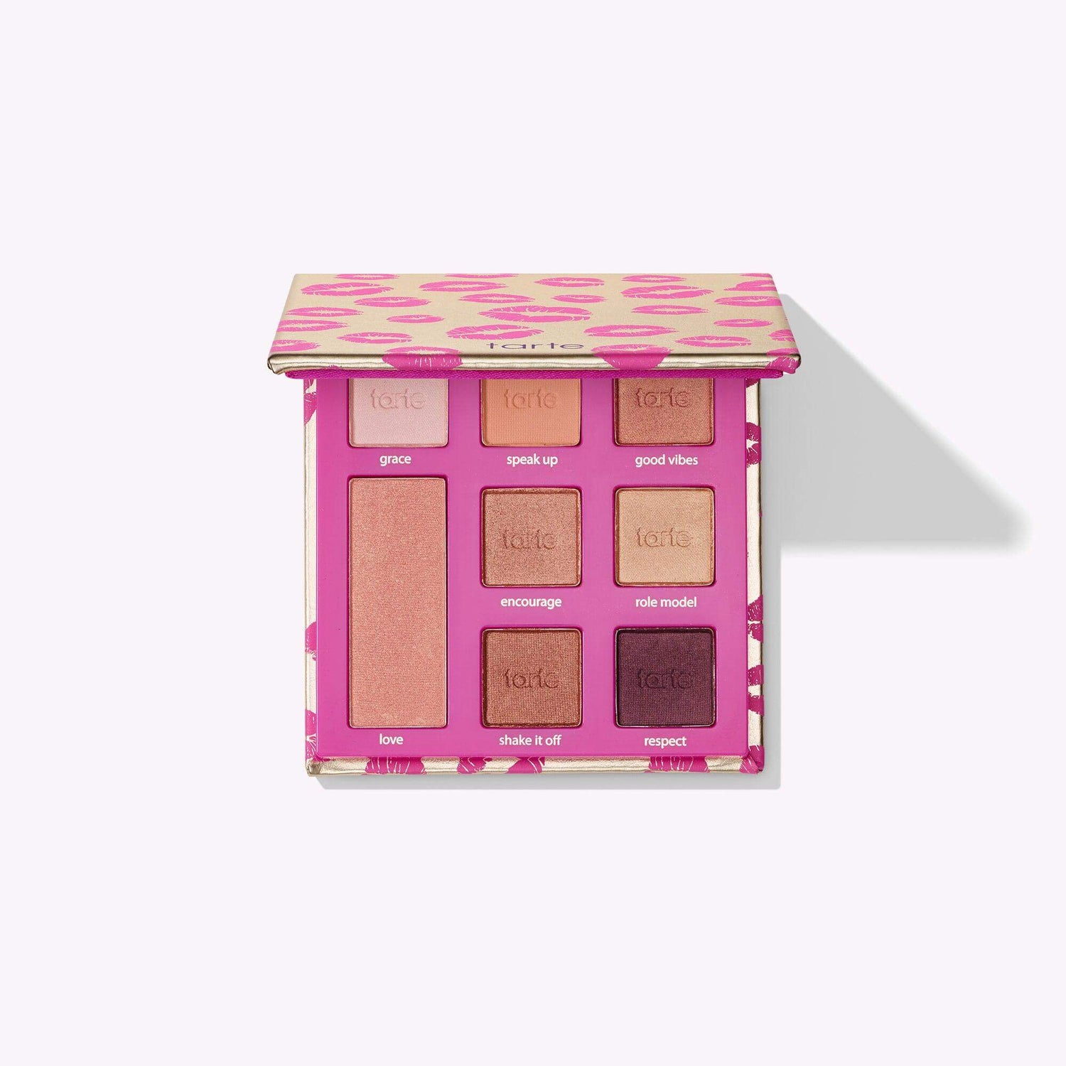 TARTE eye & cheek palette with 7 warm-toned shadows and white gold highlighter, inspired by #kissandmakeup campaign.