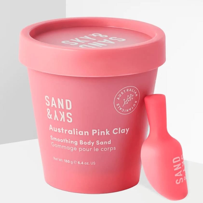 Sand & Sky Australian Pink Clay Smoothing Body Sand packaging with scoop in coral pink container, 180g.
