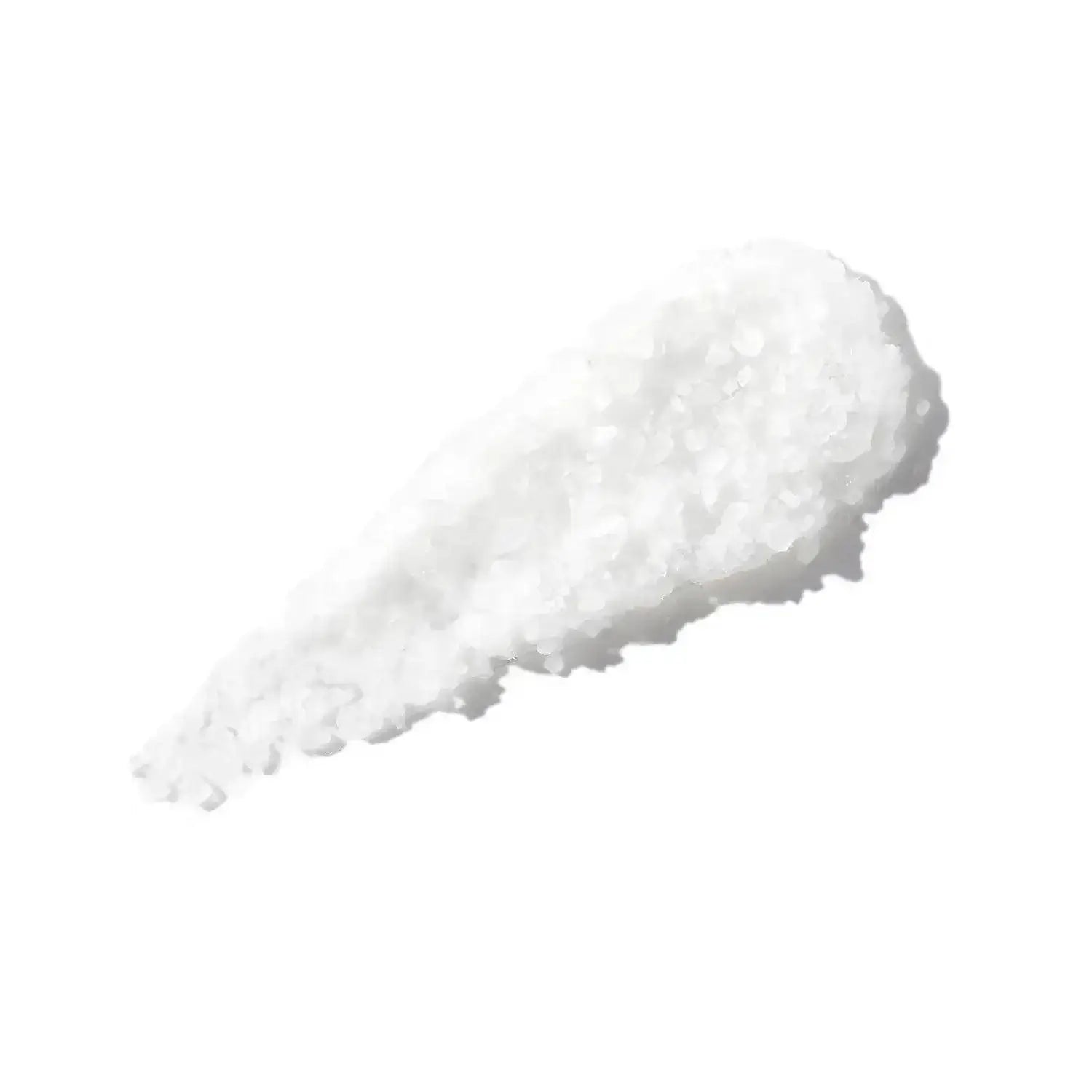 Sea salt granules used in CHRISTOPHE ROBIN Cleansing Purifying Scrub for scalp exfoliation and cleansing.
