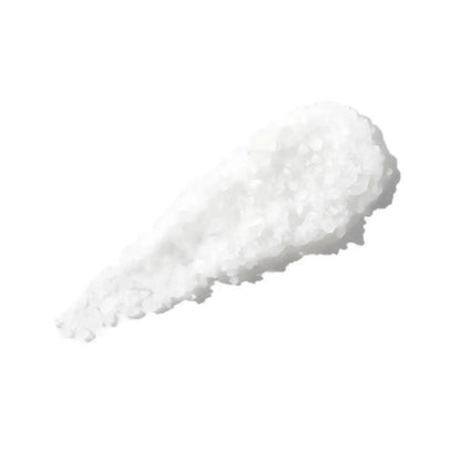 Sea salt granules used in CHRISTOPHE ROBIN Cleansing Purifying Scrub for scalp exfoliation and cleansing.