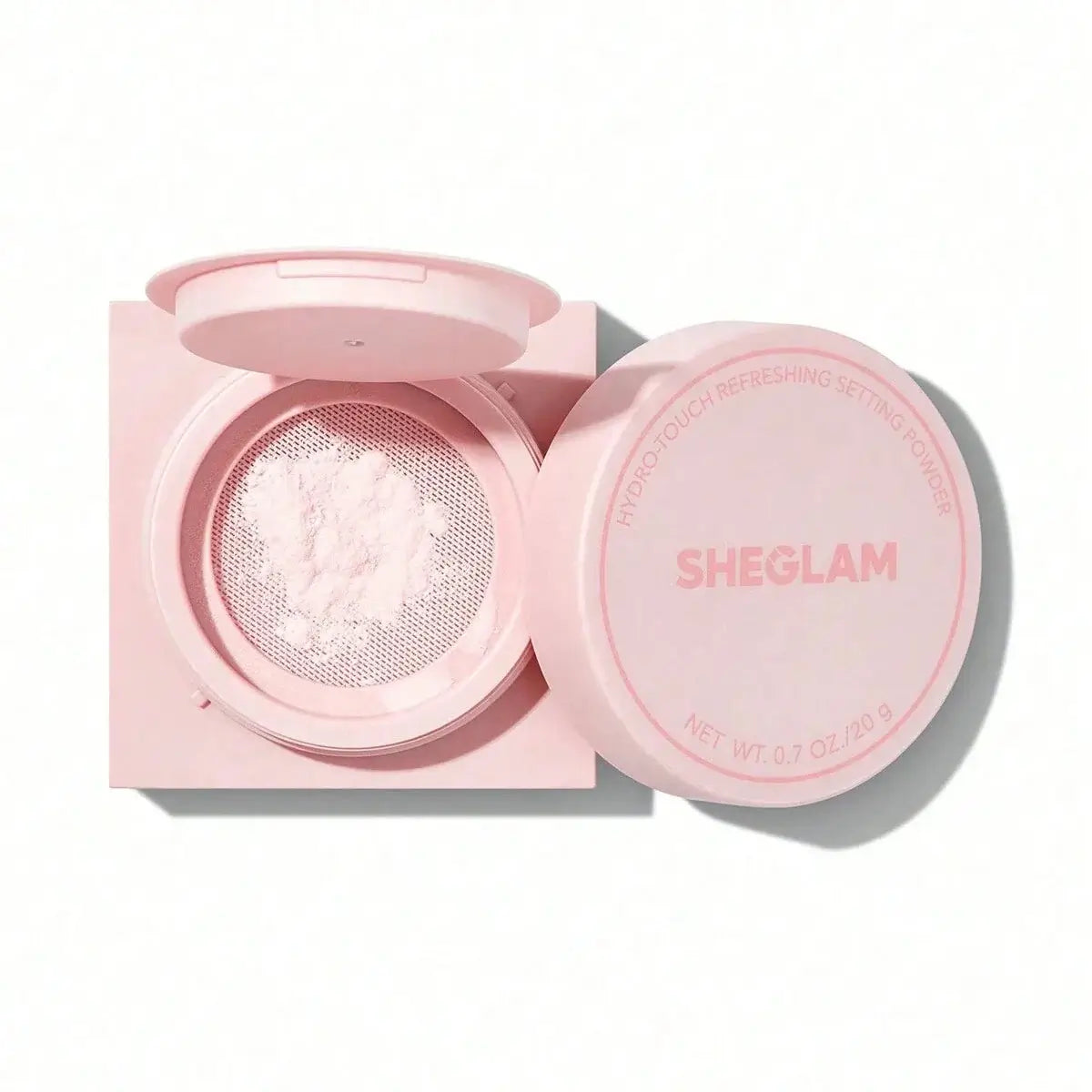 SHEGLAM Hydro-Touch Refreshing Setting Powder in pink packaging, showcasing the powder texture inside.