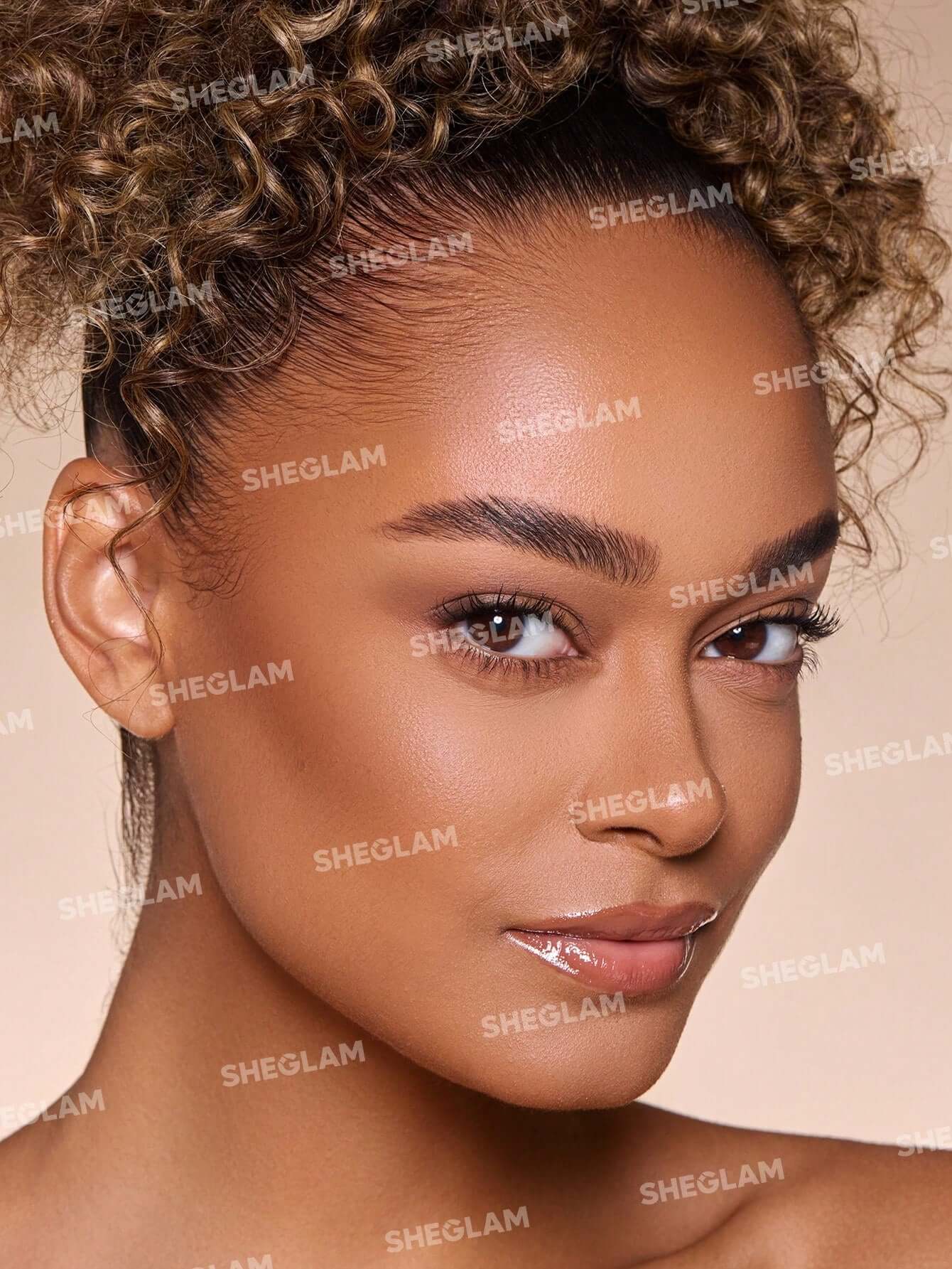 Close-up of a model showcasing perfect brows styled with SHEGLAM Set Me Up Brow Gel, featuring a radiant and natural look.