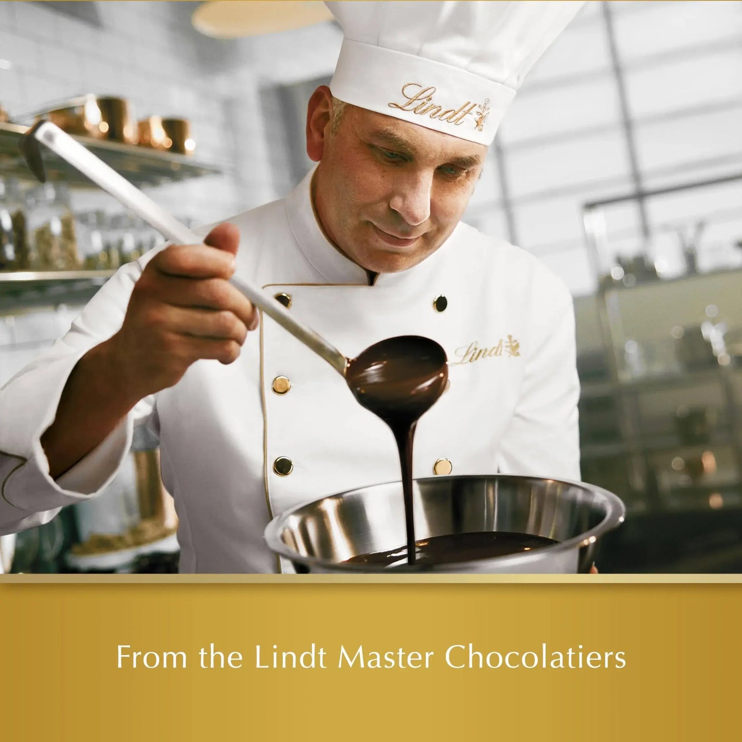 Person in a kitchen pouring chocolate from a ladle, with 'Lindt' branding.