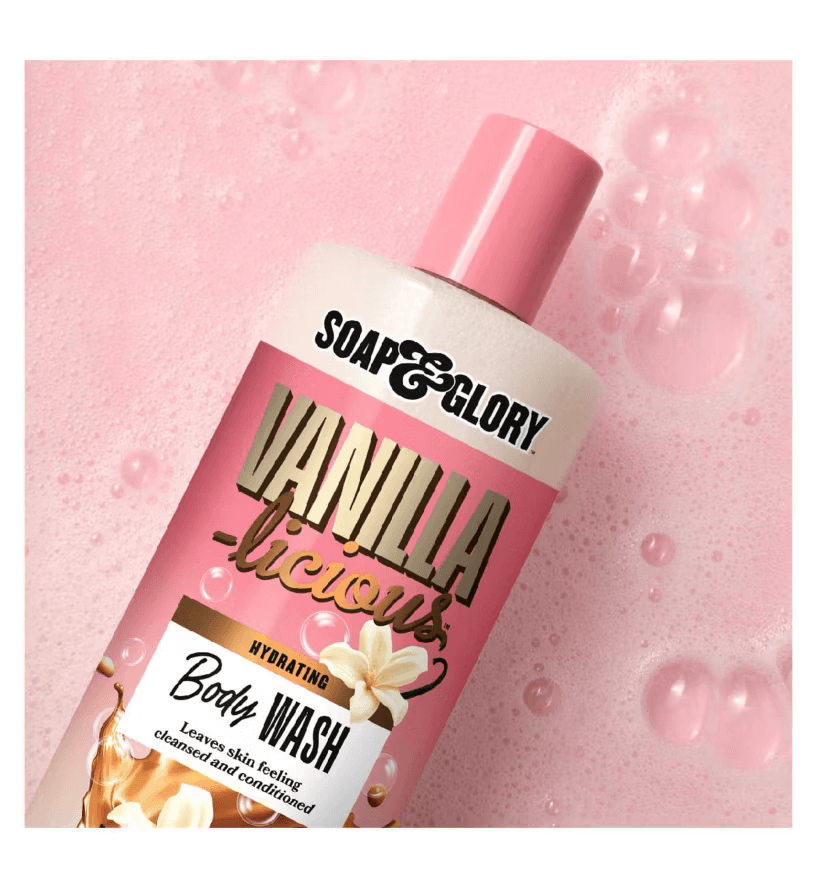 Soap & Glory Vanilla-licious Body Wash bottle on a bubbly pink background, offering hydration and a luxurious bath experience.