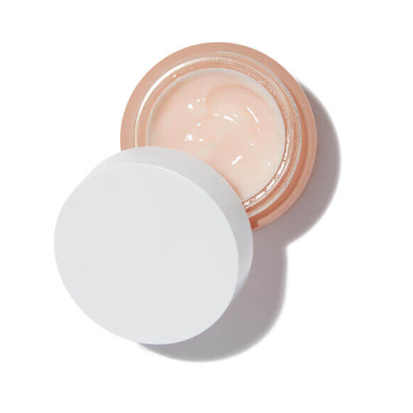 Summer Fridays cream jar with a white lid on a light background