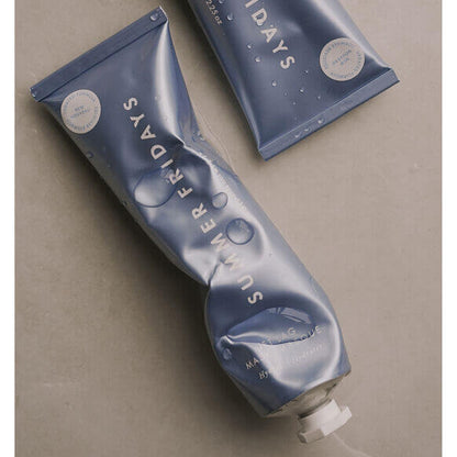 Blue tube of Summer Fridays product on a beige background
