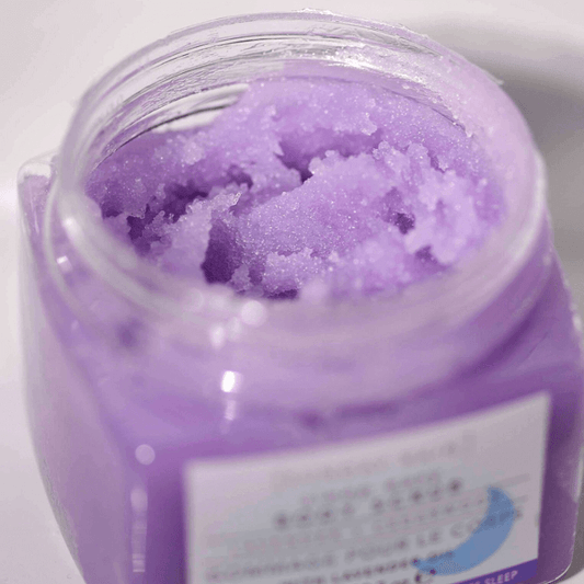 SUNDAY RAIN Lavender + Cedarwood Body Scrub in jar, showcasing purple scrub texture, ideal for soft, glowing skin.