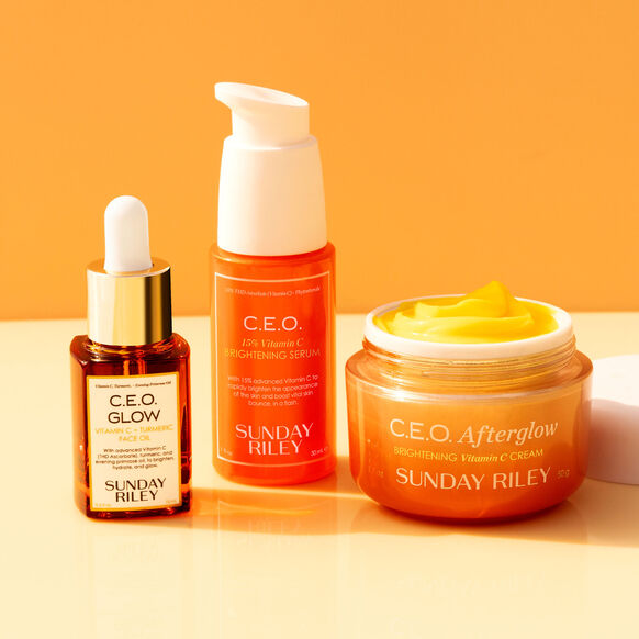 Three skincare products from Sunday Riley on a yellow background